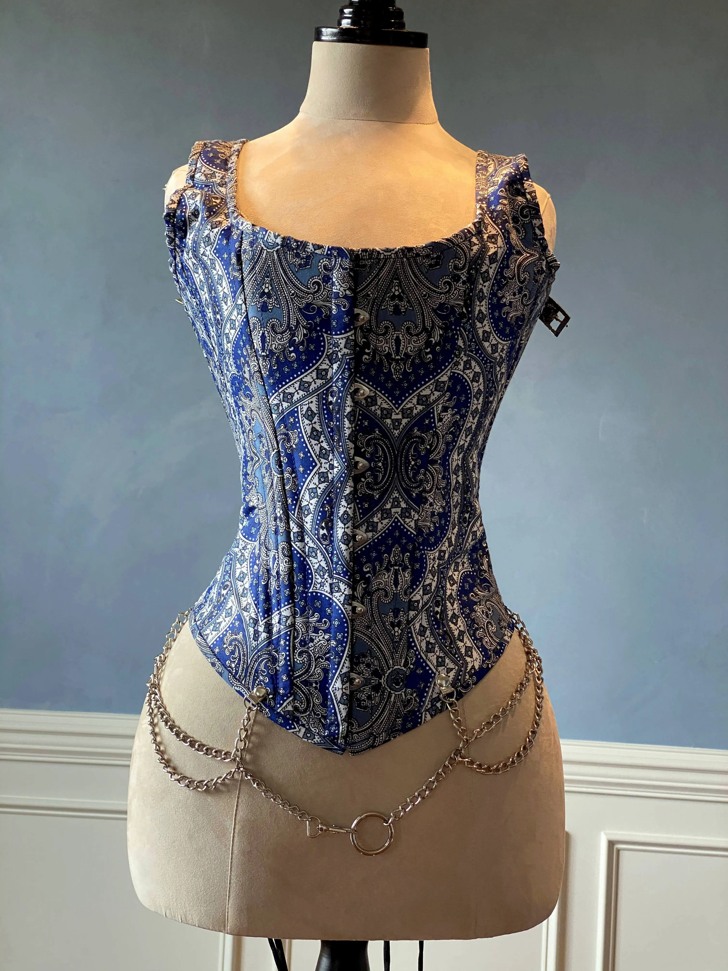 Classic brocade overbust corset vest inspired by Audrey Hepburn with shoulder straps. Steel-boned corset top for tight lacing.