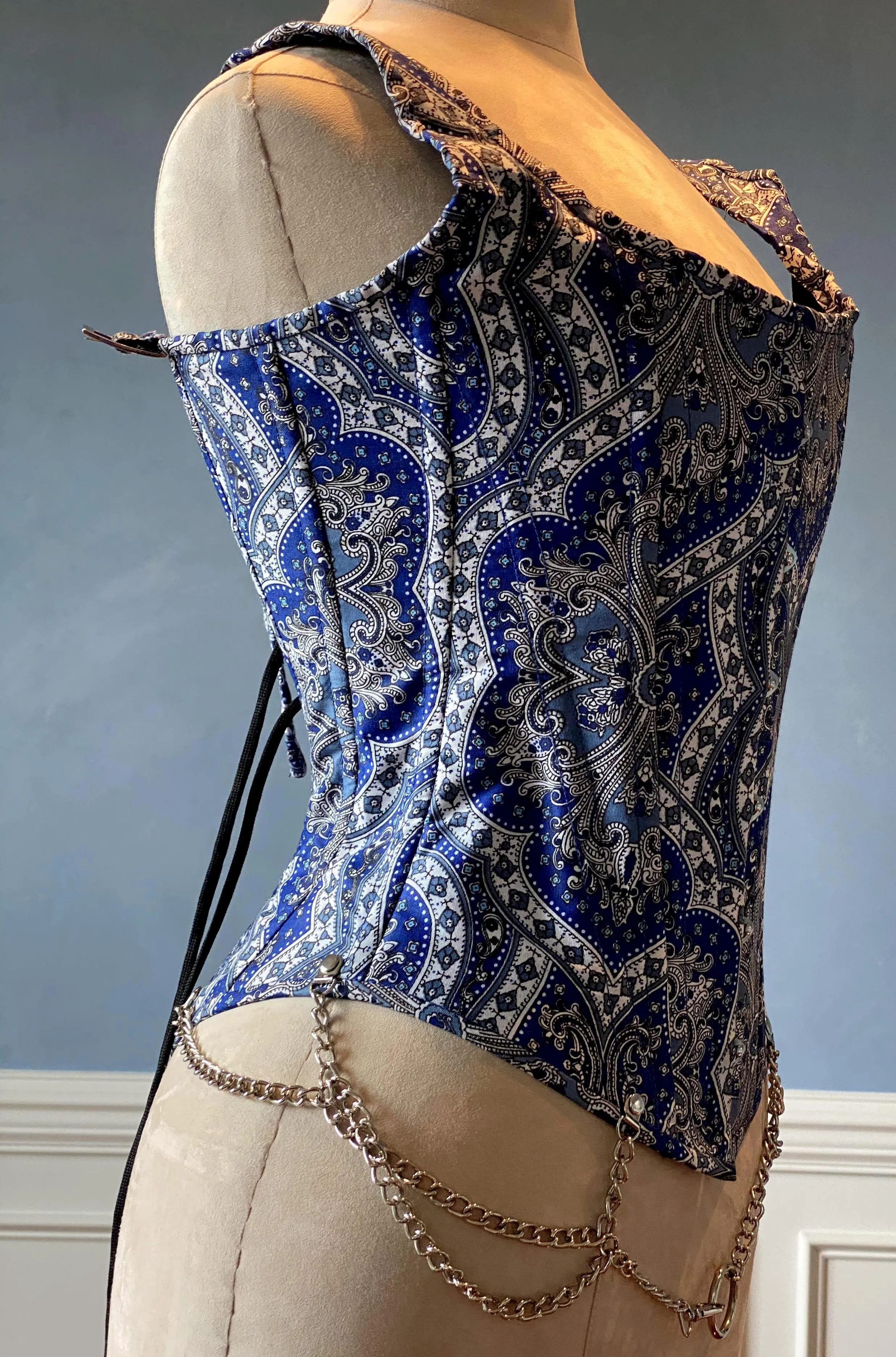 Classic brocade overbust corset vest inspired by Audrey Hepburn with shoulder straps. Steel-boned corset top for tight lacing.